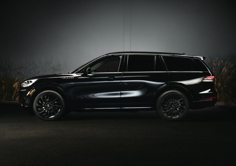 A 2024 Lincoln Aviator® SUV is shown in the Infinite Black exterior color | Hooks Lincoln in Fort Worth TX