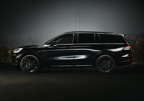 A 2024 Lincoln Aviator® SUV is shown in the Infinite Black exterior color | Hooks Lincoln in Fort Worth TX