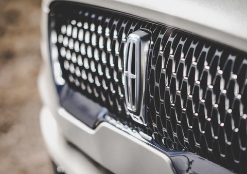 The grille of the 2024 Lincoln Aviator® Reserve model with an eye-catching repeated field of Lincoln Star logo shapes | Hooks Lincoln in Fort Worth TX